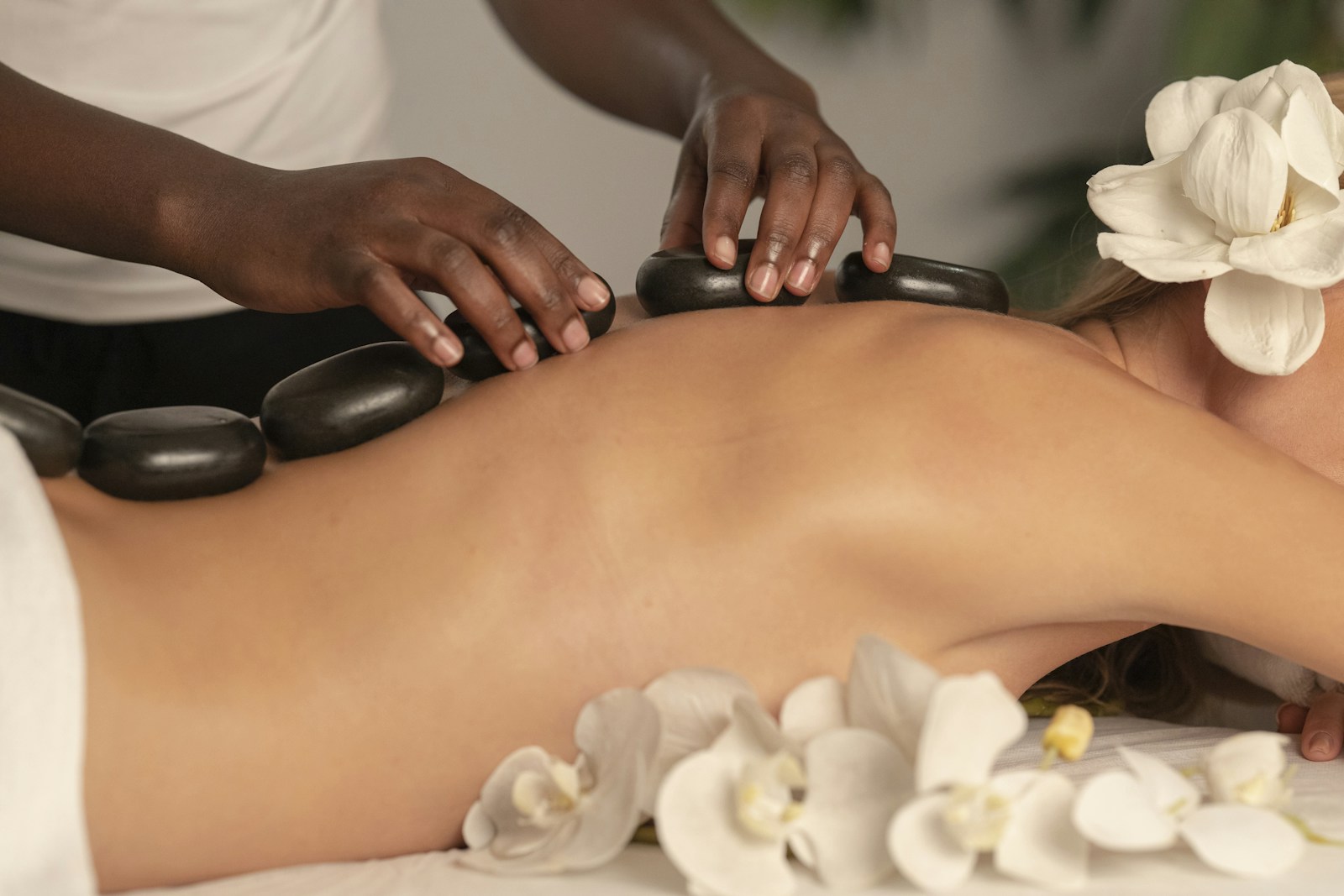 Hot stone therapy setup on a treatment table